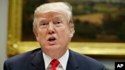 President Donald Trump speaks before hosting a lunch with Senate Republicans in the Roosevelt Room of the White House, Dec. 5, 2017, in Washington.