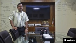 FILE - Indian businessman Pankaj Bansal poses for a picture inside his office in New Delhi, India, July 8, 2015. 