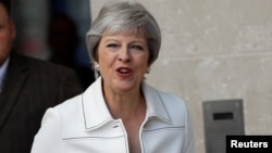 Britain's Prime Minister, Theresa May, leaves the BBC after appearing on the Andrew Marr Show, in central London, July 15, 2018.