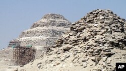 Iraqi police evacuate a victim of a bomb attack in Baghdad in January 2010 after three large blasts tied to al-Qaida hit a popular restaurant and hotel district. (AP)