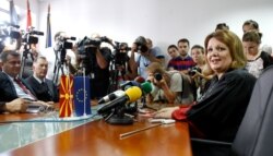 FILE - Public prosecutor Katica Janeva, right, takes an oath in Skopje, Macedonia, Sept. 16, 2015.