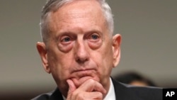 FILE - Defense Secretary Jim Mattis listens while testifying on Capitol Hill in Washington, June 13, 2017, before a Senate Armed Services Committee hearing on the defense department's budget. 