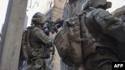 This handout picture released by the Israeli army on Jan. 22, 2024, shows Israeli soldiers operating in the Gaza Strip. (Photo by Israeli Army/AFP)