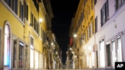 As the the national night time curfew goes into effect late Friday due to new coronavirus measures the shops and streets are empty in Rome, Italy, early Nov. 7, 2020.