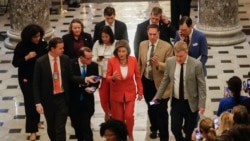 House Speaker Nancy Pelosi of California, center, is followed by members of the media as she leaves the House Chamber on Capitol Hill in Washington, Oct. 31, 2019.