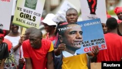 People demand the release of kidnapped school girls in the remote village of Chibok, in Lagos May 9, 2014. REUTERS/Akintunde Akinleye 