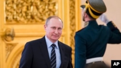 FILE - Russian President Vladimir Putin is seen in Moscow's Kremlin, Russia, in a April 5, 2016, photo. 