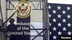FILE - A worker is seen inside the new U.S. embassy compound during preparations for its opening ceremony, in Jerusalem, May 13, 2018.