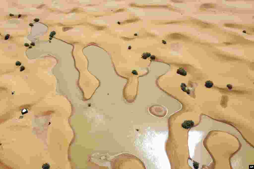 A view of lakes caused by heavy rainfall between sand dunes in the desert town of Merzouga, near Rachidia, southeastern Morocco, Oct. 2, 2024.