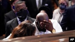 Philonise Floyd, brother, of George Floyd pauses at the casket during a funeral service for Floyd at The Fountain of Praise church, June 9, 2020, in Houston.