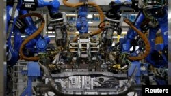 A robot is seen in the automobile production line of the new Honda plant in Prachinburi, Thailand, May 12, 2016. 