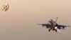 In this still image taken from video provided by the Egyptian military, an Egyptian fighter jet takes off from an undisclosed location in Egypt to strike militant hideouts in the Libyan city of Darna, May 26, 2017.