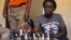 18-year-old Phiona Mutesi plays a game of chess with her colleagues at the chess academy in Kibuye, Kampala, Jan. 26, 2015. 