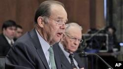 Thomas Kean (L), and Lee Hamilton, former co-chairmen of the 9/11 Commission, testify before the U.S. Senate Homeland Security and Governmental Affairs Committee hearing on the 10-year report on circumstances surrounding Sep 11, 2001 terrorist attacks, Ma