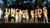 Immigration rights activists hold a "Lights for Liberty" rally and candle light vigil in front of the White House in Washington, July 12, 2019. 