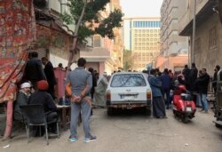 FILE - Family of those convicted and executed for the killing of public prosecuter Hisham Barakat gather at Zynhom morgue, as they wait for the bodies to be released, in Cairo, Egypt, Feb. 20, 2019.