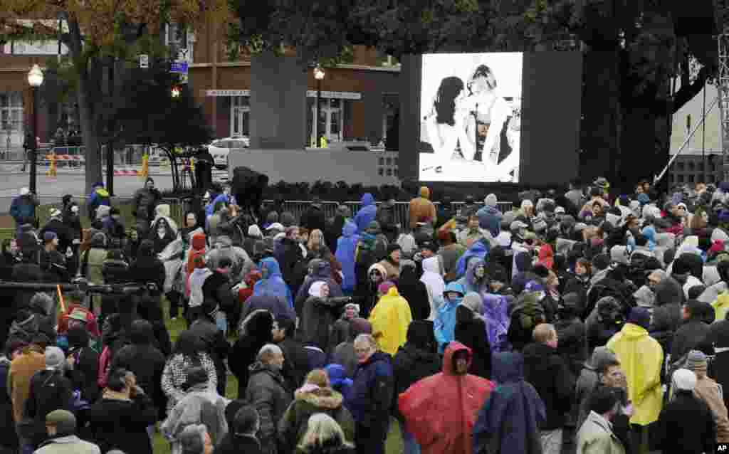 Images of the Kennedys are displayed at a ceremony to mark the 50th anniversary of the assassination of John F. Kennedy, at Dealey Plaza in Dallas,Texas, Nov. 22, 2013. 