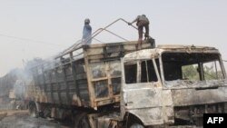 Photo taken in Auno, Nigeria, shows trucks destroyed by suspected members of the Islamic State West Africa Province (ISWAP) during an attack on Feb. 9, 2020.