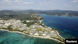 FILE - Coral reefs are seen along the coast near the U.S. Marine base Camp Schwab, off the tiny hamlet of Henoko in Nago, on the southern Japanese island of Okinawa, in this file aerial photo taken by Kyodo.
