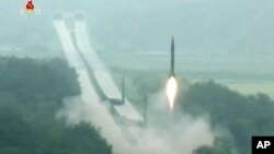This undated picture shows several North Korean missiles being launched at once. North Korea launched four missiles on Monday. They traveled about 1,000 km. before falling into the sea.