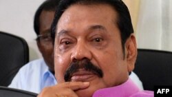 FILE - Sri Lankan former President Mahinda Rajapakse addresses journalists at his residence in Colombo, Sept. 22, 2018. Rajapakse has been appointed the Sri Lanka's new prime minister. 