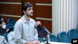 FILE - In this photo released by Mizan News Agency, Mohammad Mehdi Karami, a protester convicted and executed, speaks during his trial in Karaj, Iran, on Nov. 30, 2022. Karami's father, Mashallah Karami, was sentenced to six years in prison, his lawyer announced on May 25, 2024.