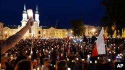 Thousands of anti-government protesters with lit candles gather in front of the Supreme Court in a continuation of protest in Warsaw, Poland, July 16, 2017.