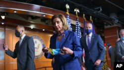 Speaker of the House Nancy Pelosi, D-Calif., leaves at the end of a news conference on priority issues, including voting rights, public health, and infrastructure, at the Capitol in Washington, July 30, 2021.