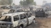 Dalam foto yang diambil pada 10 Februari 2020 ini, tampak mobil-mobil terbakar dalam serangan yang diduga dilakukan kelompok ISIS Provinsi Afrika Barat (ISWAP) di Auno, Nigeria. (Foto: AFP/Audu Marte)