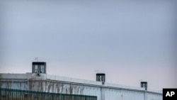 FILE - Guard towers are seen along the perimeter wall of the Urumqi No. 3 Detention Center in Dabancheng in western China's Xinjiang Uyghur Autonomous Region, April 23, 2021.