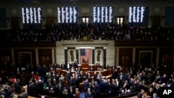 House members vote as House Speaker Nancy Pelosi of Calif., stands on the dais, during a vote on article II of impeachment against President Donald Trump, Wednesday, Dec. 18, 2019, on Capitol Hill in Washington. (AP Photo/Patrick Semansky)