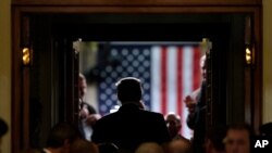 FILE - President Donald Trump arrives to deliver his State of the Union address to a joint session of Congress, on Capitol Hill in Washington, Feb. 5, 2019.