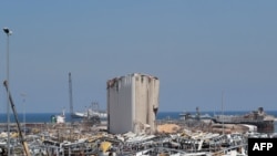 FILE - This Aug. 25, 2020, photo shows the damaged grain silos amid the destruction at Beirut's harbor, in the aftermath of the monster explosion at the port which ravaged swathes of the capital in early August.