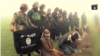 FILE - Image from purported Islamic State group video shows captives.