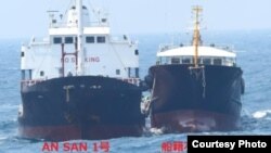 A duck hunter motors by the reflection of a train trestle on the Androscoggin River, Oct. 29, 2021, in Brunswick, Maine.