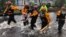 Search and Rescue workers from New York rescue a man from flooding caused by Hurricane Florence in River Bend, North Carolina, U.S. in this Sept. 14, 2018 handout photo. 