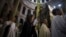 Christian clergy and worshipers hold palm fronds during a procession in the Church of the Holy Sepulcher in Jerusalem's Old City March 24, 2013.
