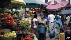 Women sell vegetables and other food in a market on World Food Day in Lagos, Nigeria, Tuesday, Oct. 16, 2012. One in eight people around the world goes to bed hungry every night, according to the United Nations.