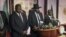 South Sudan President Salva Kiir (C), flanked by former rebel leader Riek Machar (L) and other government officials, addresses a news conference at the Presidential State House in Juba, South Sudan, July 8, 2016. 