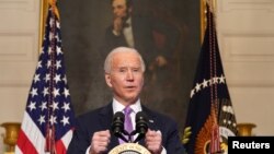 Presiden AS Joe Biden memaparkan rencana untuk memerangi pandemi Covid-19, di Gedung Putih, Washington, Selasa, 26 Januari 2021. 