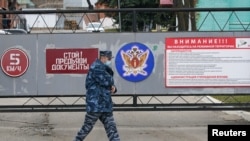 An officer walks outside the IK-3 penal colony, which houses a hospital where jailed Kremlin critic Alexey Navalny was reportedly transferred, in Vladimir, Russia, April 20, 2021.