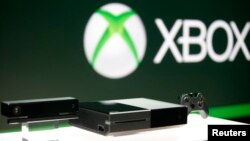 FILE - Xbox One (C) with the Kinect motions sensor (L) and the controller is pictured during a press event unveiling Microsoft's new Xbox in Redmond, May 21, 2013.
