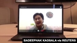Thai medical student Badeephak Kaosala is seen on a computer screen as he speaks in an interview about being stranded in Wuhan, China, Jan. 27, 2020 in this still image taken from social media video. (Credit: Badeephak Kaosala)