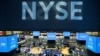 FILE - Traders work on the floor at the New York Stock Exchange, Aug. 12, 2019.