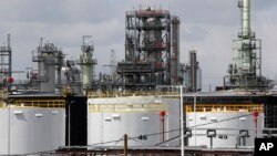 FILE - Storage tanks are shown at a refinery in Detroit, Tuesday, April 21, 2020. (AP Photo/Paul Sancya, File)