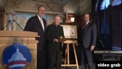 Dutch ambassador Henne Schuwer, left, with recipients of the 2017 Anne Frank Award: the Rev. Leo J. O'Donovan, center, on behalf of the Jesuit Refugee Service, and Robert Quinn, founding executive director of Scholars at Risk.