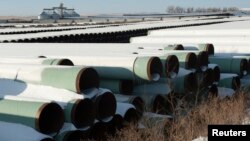 Tempat penyimpanan pipa milik TransCanada Corp.'s untuk saluran minyak Keystone XL di Gascoyne, North Dakota, 14 November 2014 (Foto: dok). 