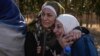 Two women whose relatives were imprisoned embrace outside the infamous Sednaya military prison, just north of Damascus, Syria, Dec. 9, 2024. Thousands of inmates were released after Bashar al-Assad's regime was overthrown Dec. 8.