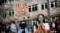 FILE - Demonstrators cheer while listening to speakers during a protest against anti-Asian hate crimes at Hing Hay Park in the Chinatown-International District of Seattle, Washington, March 13, 2021.