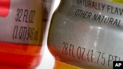 Bottles of Gatorade are pictured, left, a 32 fluid ounce and 28 fluid ounce, in Glenside, Pa., Monday, June 6, 2022. (AP Photo/Matt Rourke)